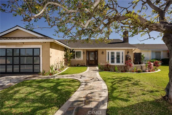 a view of a house with a yard patio and slide