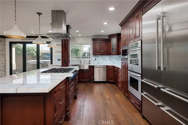 a kitchen with a stove and a fireplace