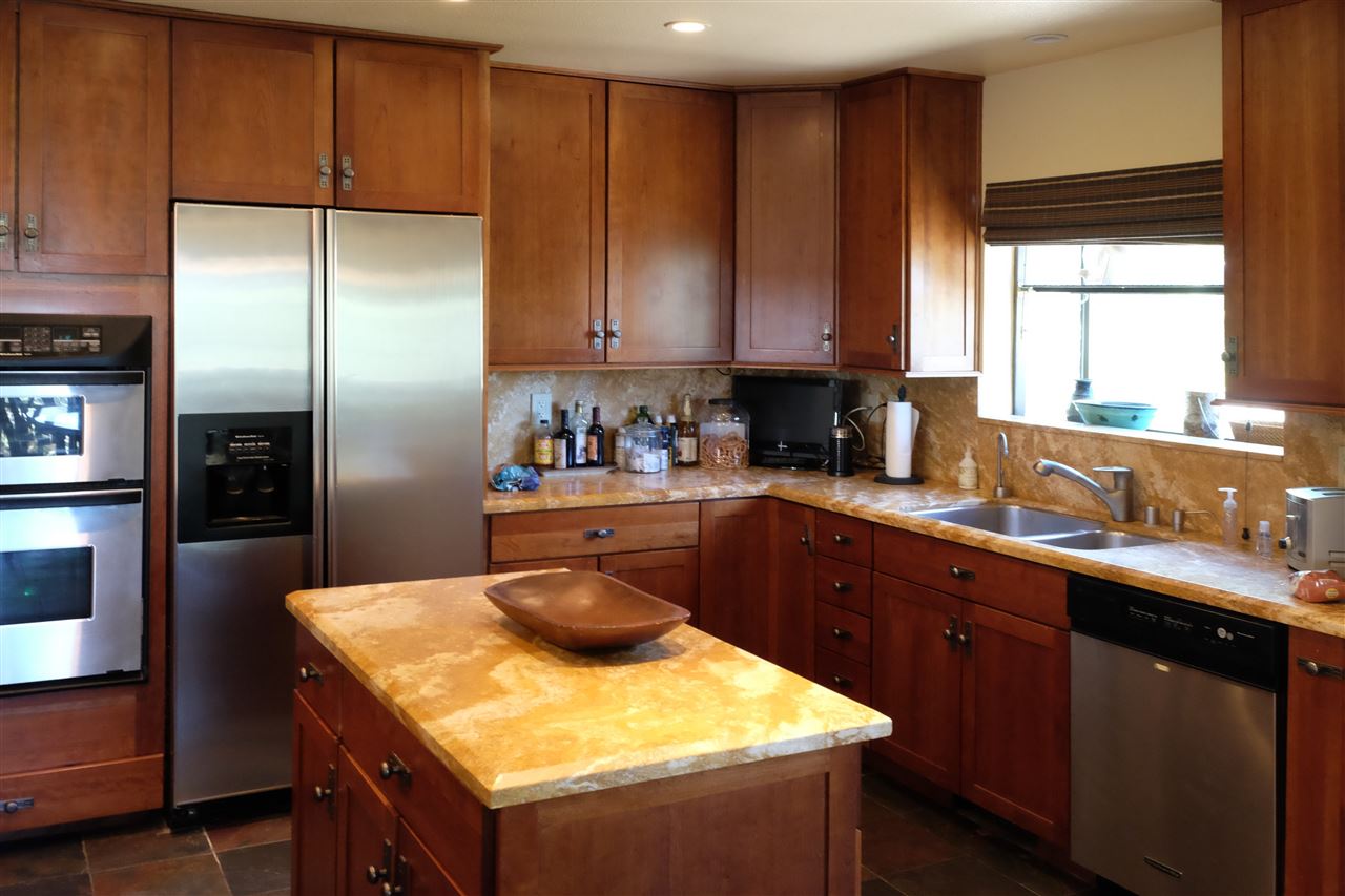 334 Davison Road Mammoth Lakes, CA 93546 - Photo 5 of 15 a kitchen with a sink a refrigerator and cabinets
