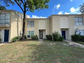 6200 West Tidwell Road, Unit 501 Houston, TX 77092 - Photo 3 of 6 a view of a house with a yard and potted plants