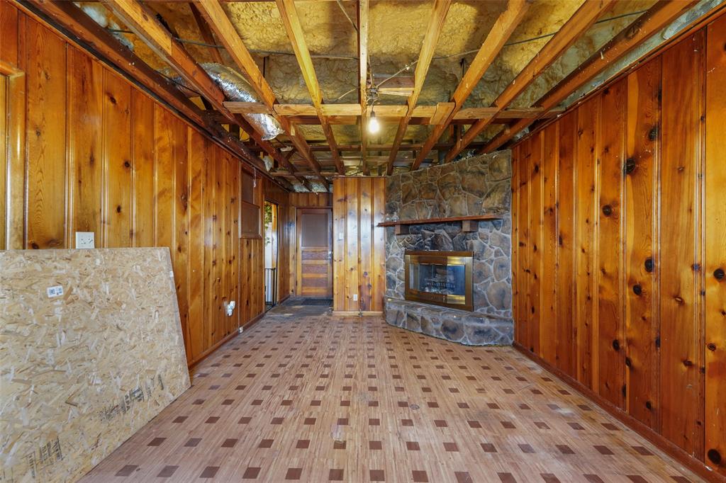 1051 Lynch Bend Road Springtown, TX 76082 - Photo 18 of 39 a view of a hallway with wooden walls