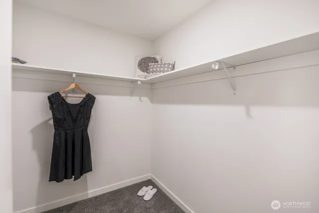 a room with a walk in closet and a window