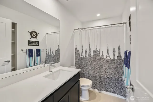 a view of a bedroom with furniture and stairs