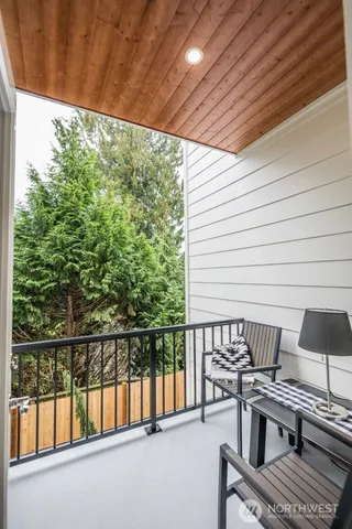 a view of a balcony with chairs