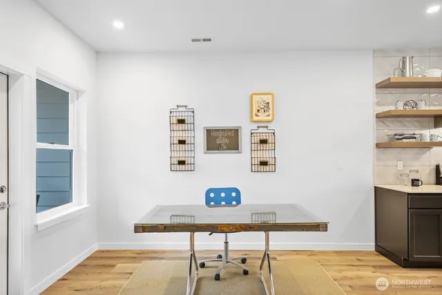 a view of a workspace with furniture