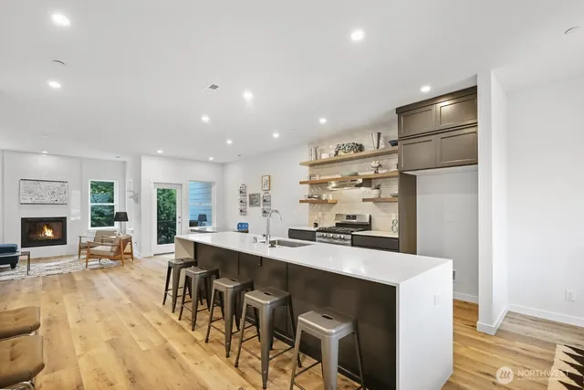a large kitchen with a table and chairs