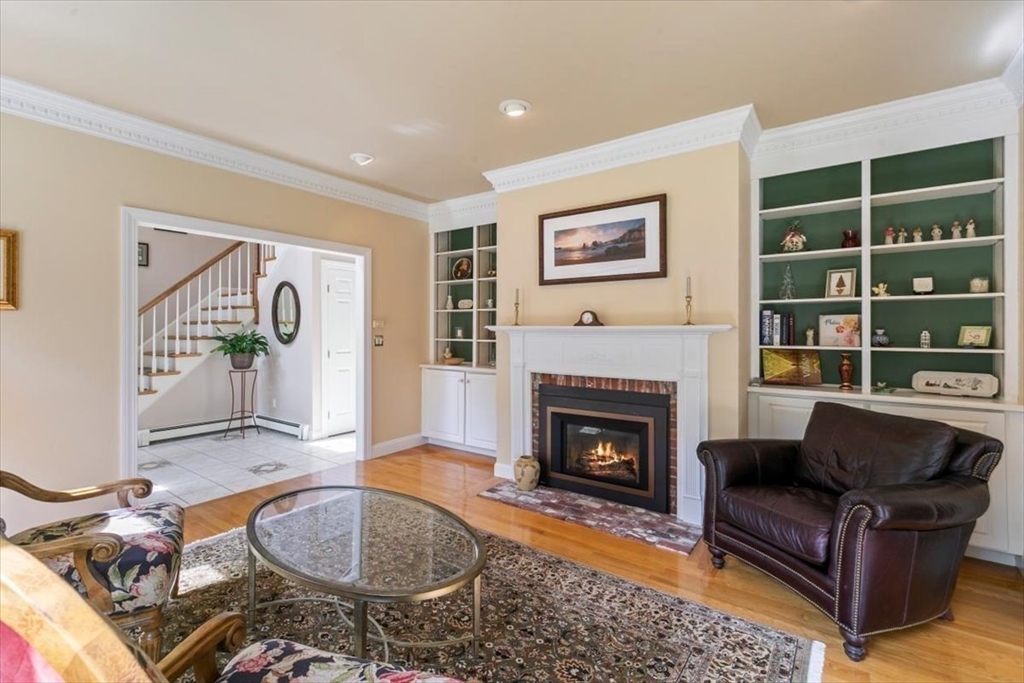 9 Perley Lane Boxford, MA 01921 - Photo 18 of 41 a living room with furniture and a fireplace