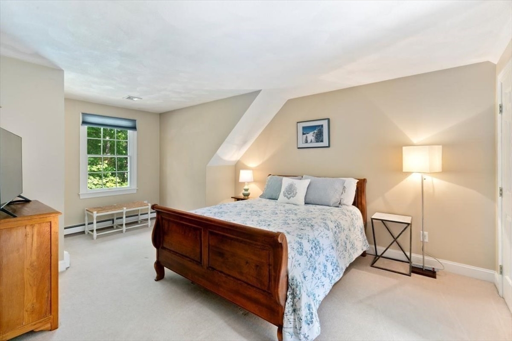 9 Perley Lane Boxford, MA 01921 - Photo 27 of 41 a bedroom with a bed and a couch