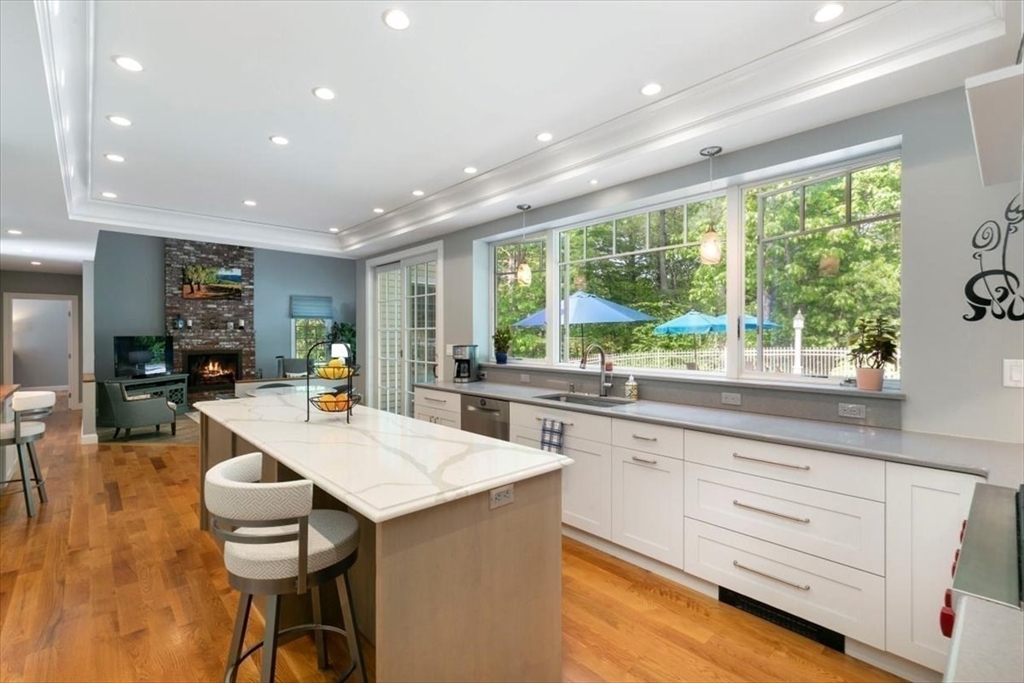 9 Perley Lane Boxford, MA 01921 - Photo 10 of 41 a kitchen with stainless steel appliances kitchen island a large window in it