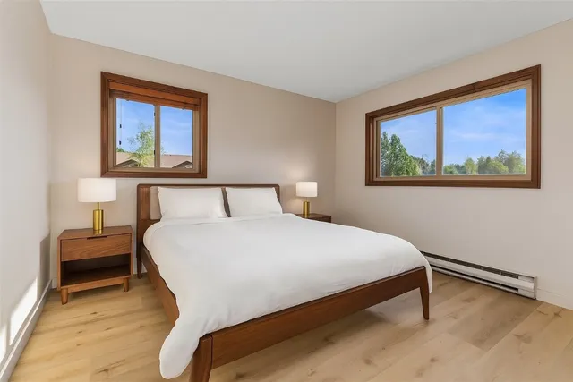 a bedroom with a bed and window