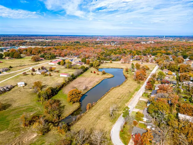 an aerial view of residential building and ocean view