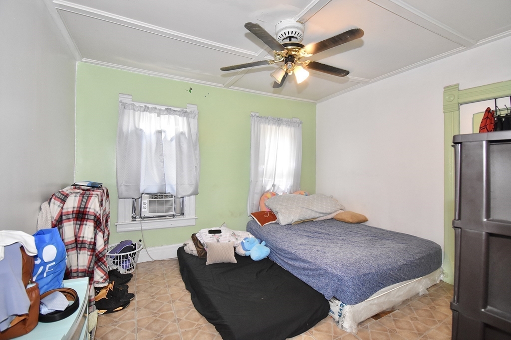 98 Alderman Street Springfield, MA 01108 - Photo 11 of 20 a living room with furniture and a chandelier