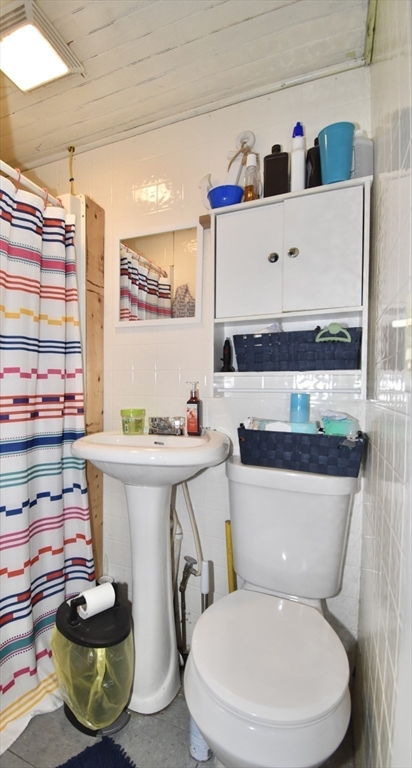 98 Alderman Street Springfield, MA 01108 - Photo 18 of 20 a bathroom with a sink and a mirror