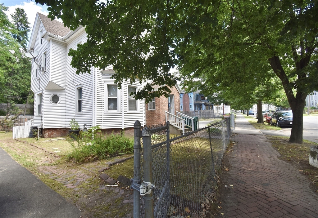 98 Alderman Street Springfield, MA 01108 - Photo 20 of 20 a view of a yard with plants and trees