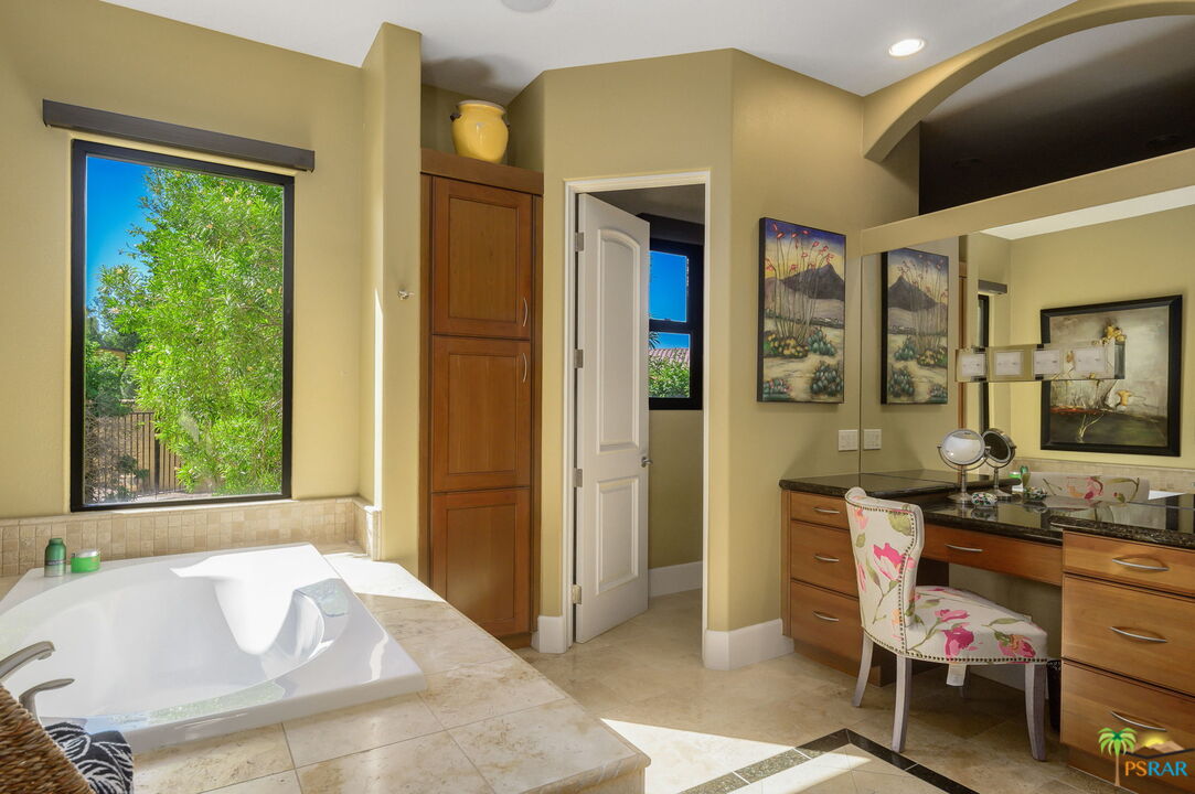 38851 Nielson Road Rancho Mirage, CA 92270 - Photo 13 of 50 a spacious bathroom with a granite countertop tub sink and mirror