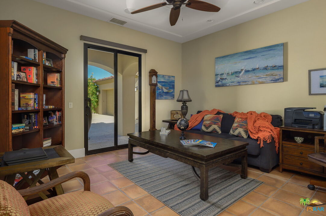 38851 Nielson Road Rancho Mirage, CA 92270 - Photo 16 of 50 a living room with furniture or couch and a bookshelf