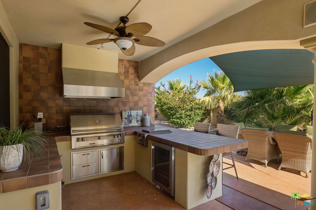 38851 Nielson Road Rancho Mirage, CA 92270 - Photo 20 of 50 a kitchen with a stove a sink and a microwave