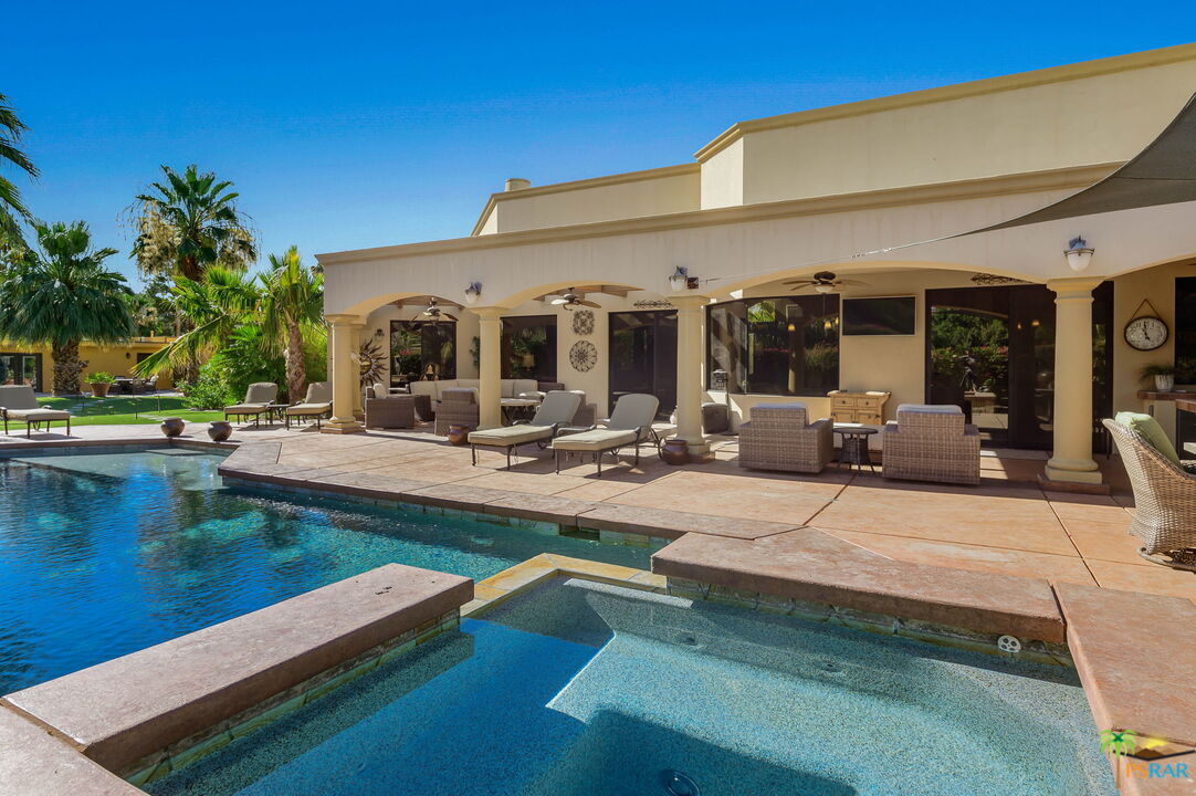 38851 Nielson Road Rancho Mirage, CA 92270 - Photo 24 of 50 a view of a patio with swimming pool table and chairs
