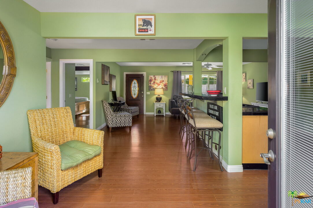 38851 Nielson Road Rancho Mirage, CA 92270 - Photo 31 of 50 a living room with furniture and a wooden floor