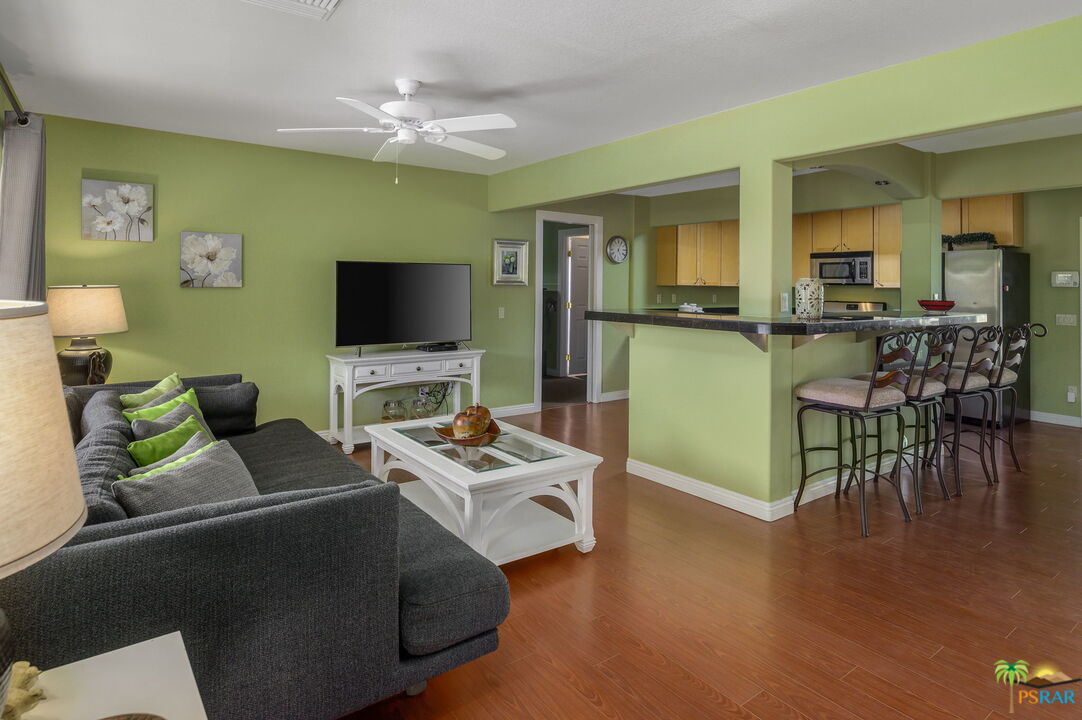 38851 Nielson Road Rancho Mirage, CA 92270 - Photo 34 of 50 a living room with furniture and a flat screen tv