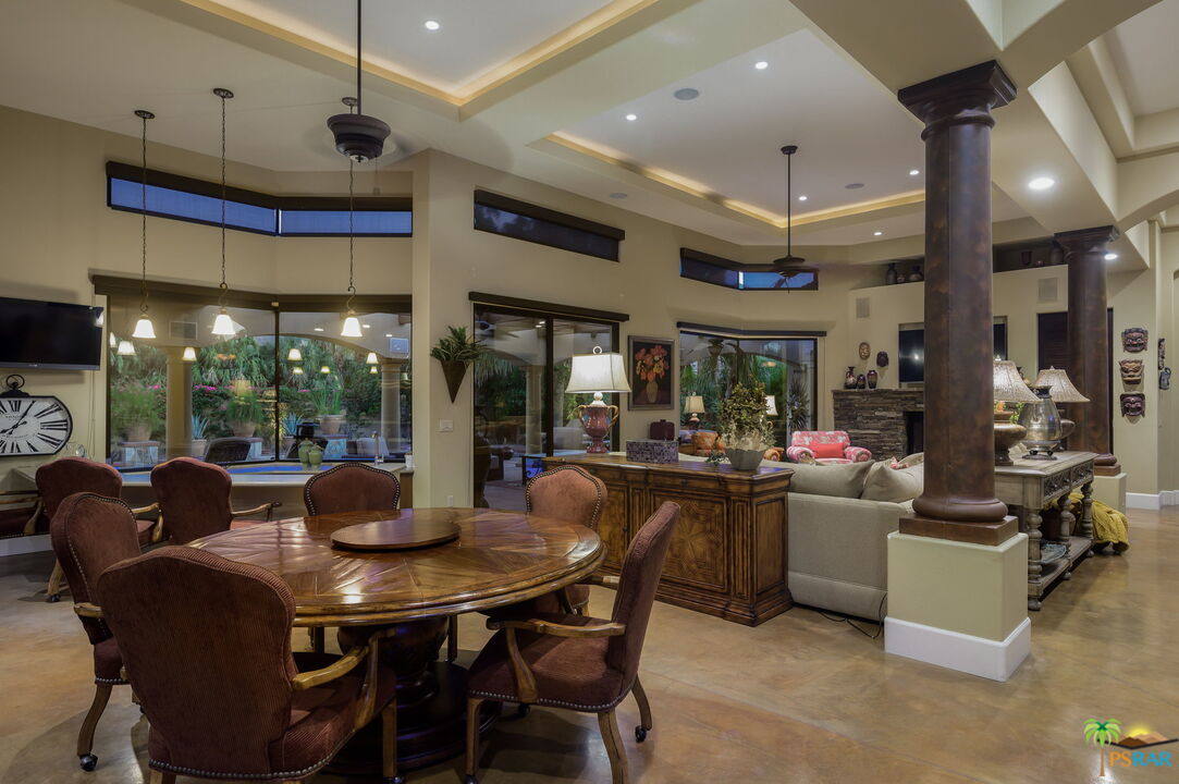 38851 Nielson Road Rancho Mirage, CA 92270 - Photo 42 of 50 a view of a dining room with furniture wooden floor and chandelier