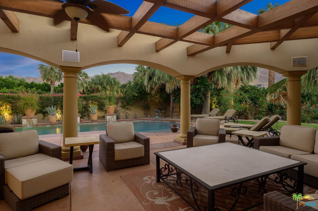 38851 Nielson Road Rancho Mirage, CA 92270 - Photo 44 of 50 a outdoor space with patio couches and a table with garden view