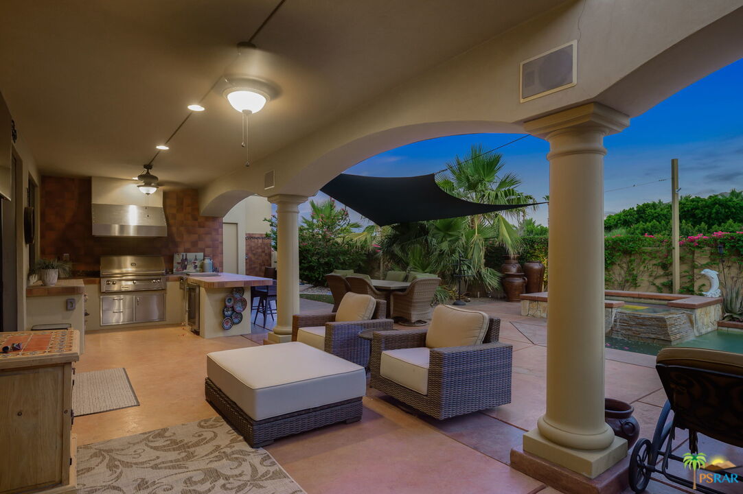 38851 Nielson Road Rancho Mirage, CA 92270 - Photo 45 of 50 a living room with furniture and a large window