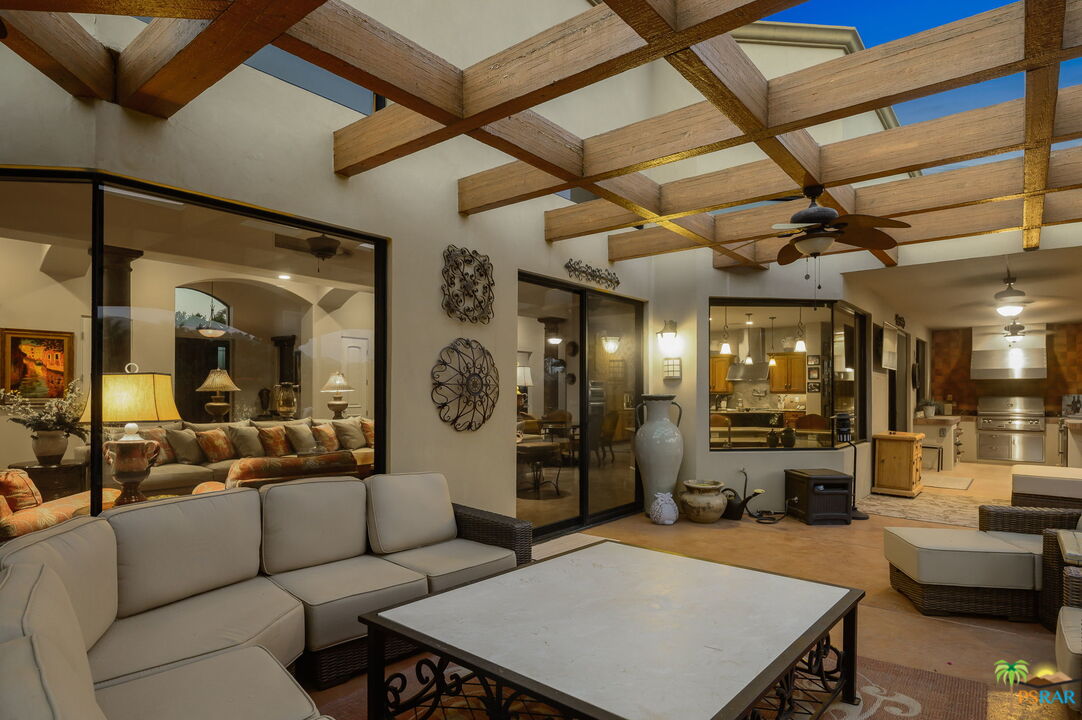 38851 Nielson Road Rancho Mirage, CA 92270 - Photo 49 of 50 a living room with furniture and a clock