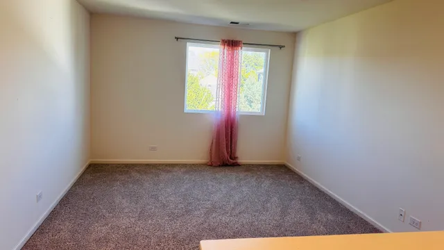 an empty room with window