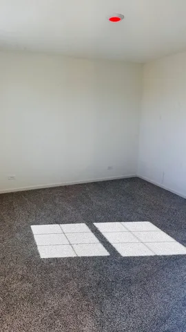 an empty room with an umbrella