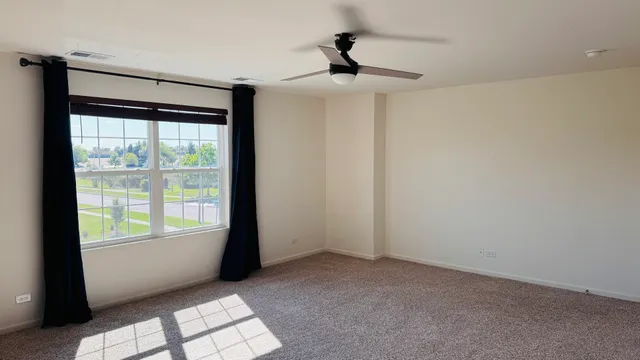 a view of an empty room and window