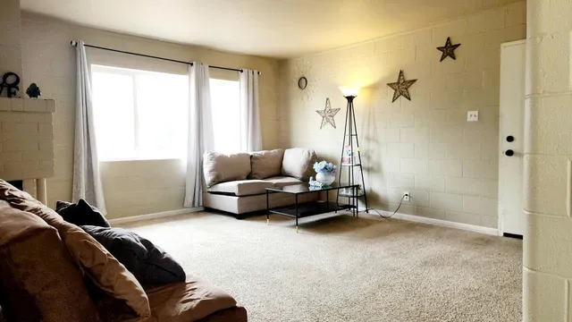 a bedroom with bed and a window