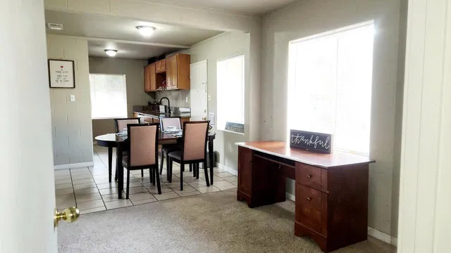 a view of a dining room with furniture