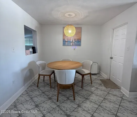 a view of a dining room and livingroom