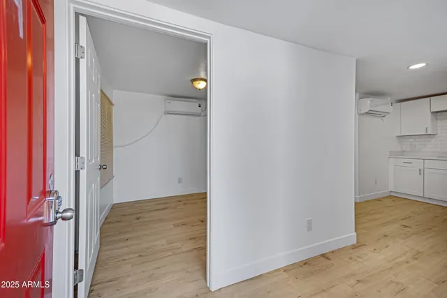 a view of a kitchen with wooden floor