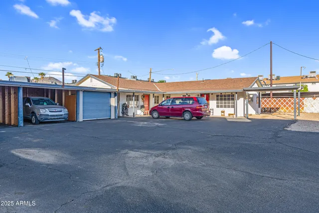 a view of a porch with a table and chairs