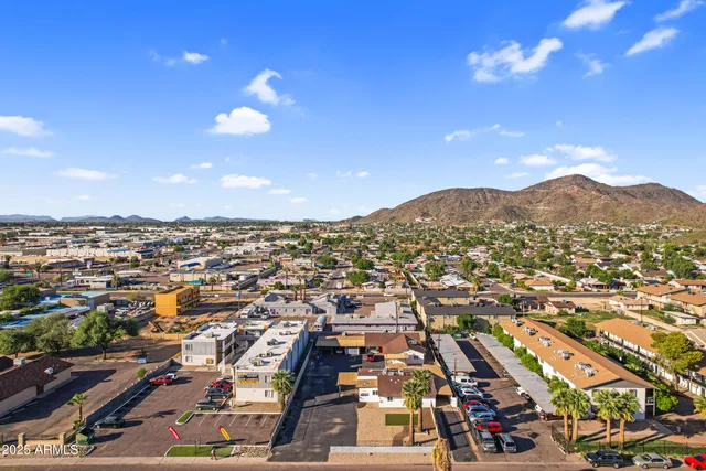 an aerial view of a houses with outdoor space