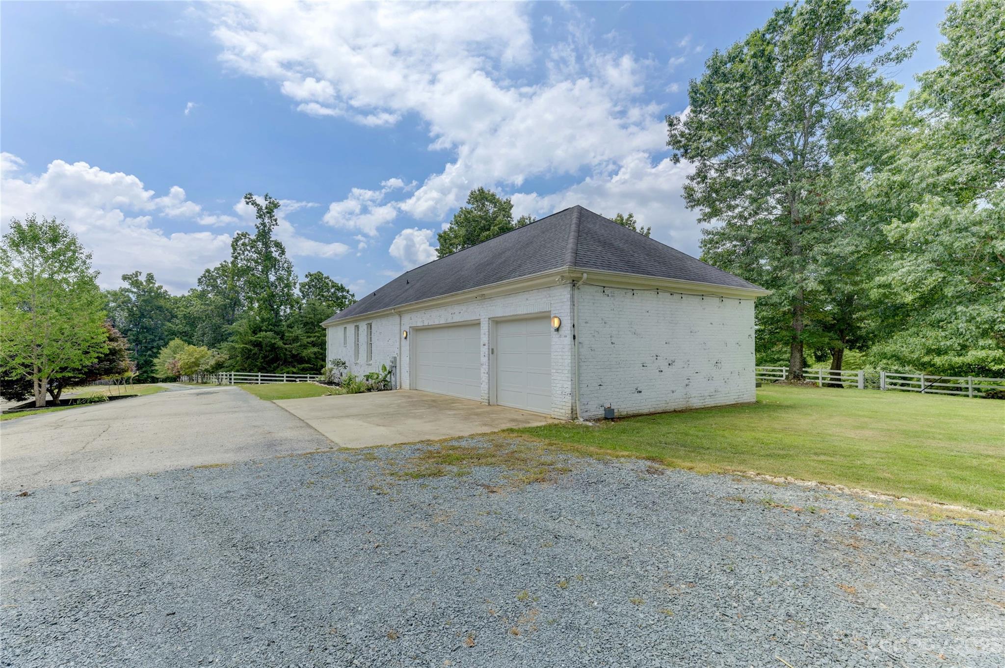 2354 Vineyard Road Fort Mill, SC 29708 - Photo 27 of 48 a big house with a big yard and large trees