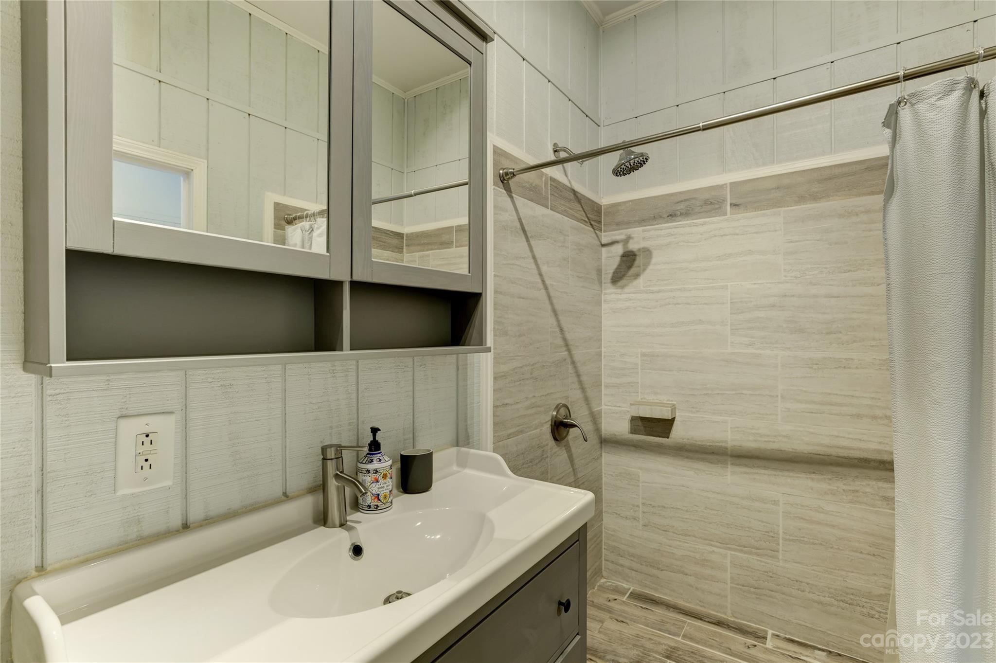 2354 Vineyard Road Fort Mill, SC 29708 - Photo 43 of 48 a bathroom with a sink a shower and a mirror