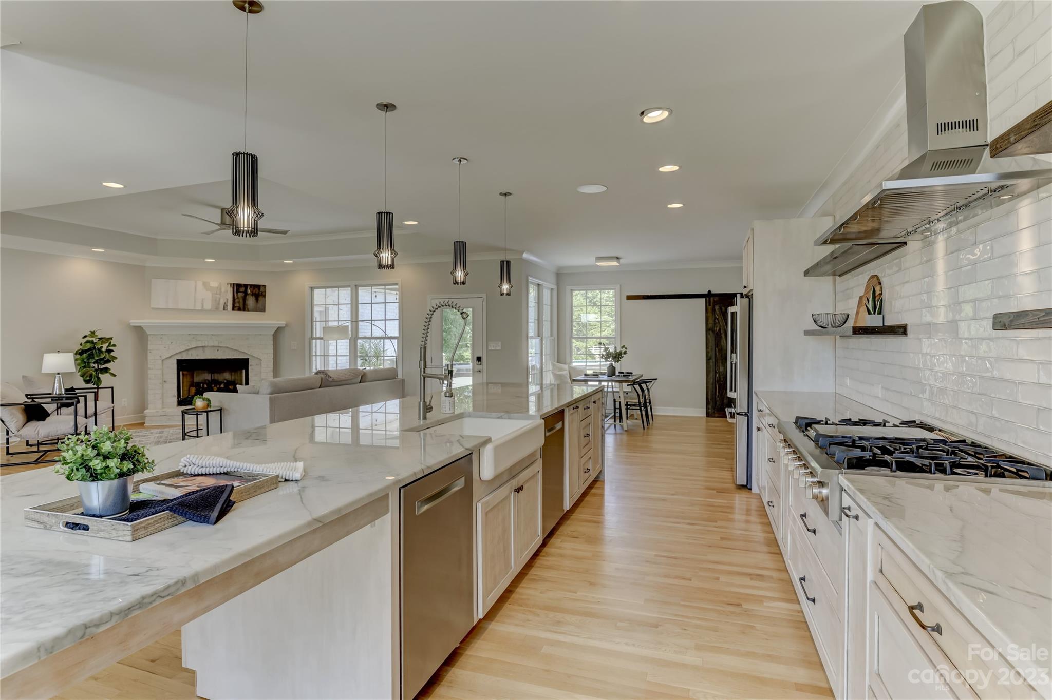2354 Vineyard Road Fort Mill, SC 29708 - Photo 10 of 48 a large kitchen with stainless steel appliances a large counter top a stove and a sink