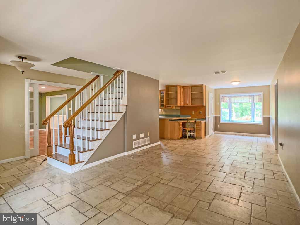 315 Saly Road Yardley, PA 19067 - Photo 3 of 43 Tiled floor flows through family room and kitchen