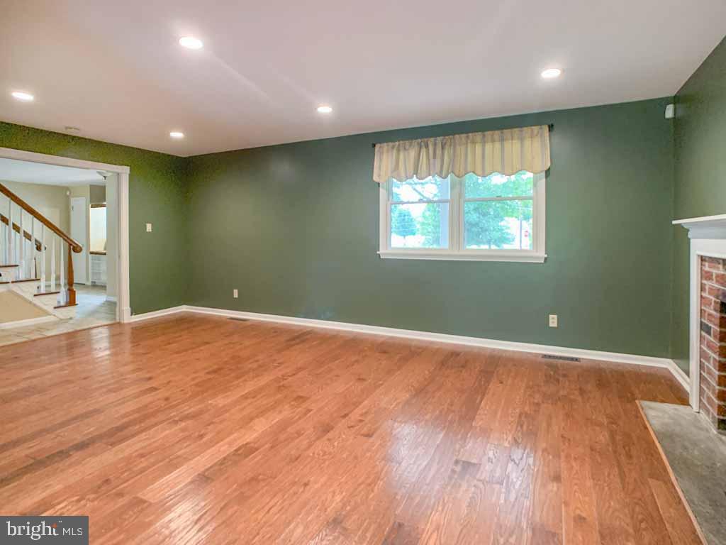 315 Saly Road Yardley, PA 19067 - Photo 32 of 43 Large living room with pocket doors to the foyer