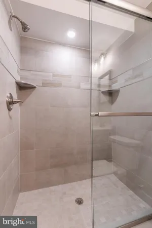a bathroom with a sink mirror and vanity