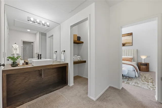 a spacious bathroom with a double vanity sink and a mirror