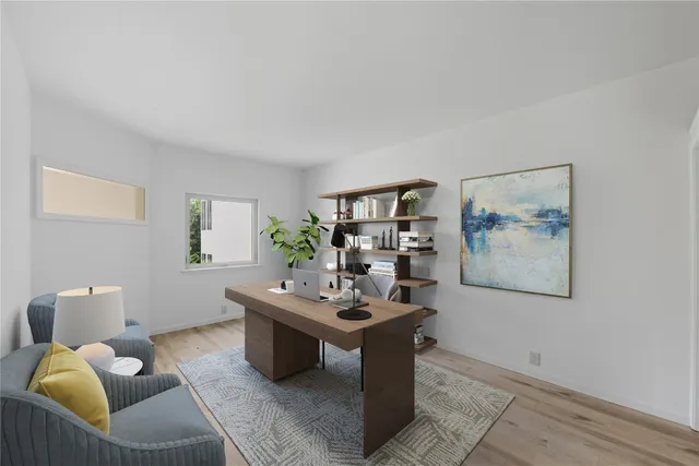 a living room with furniture and white walls