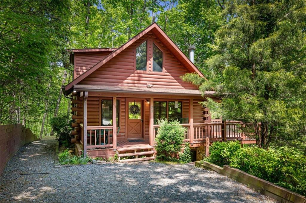 88 Indian Rock Road Blue Ridge, GA 30513 - Photo 1 of 1 a front view of a house with garden