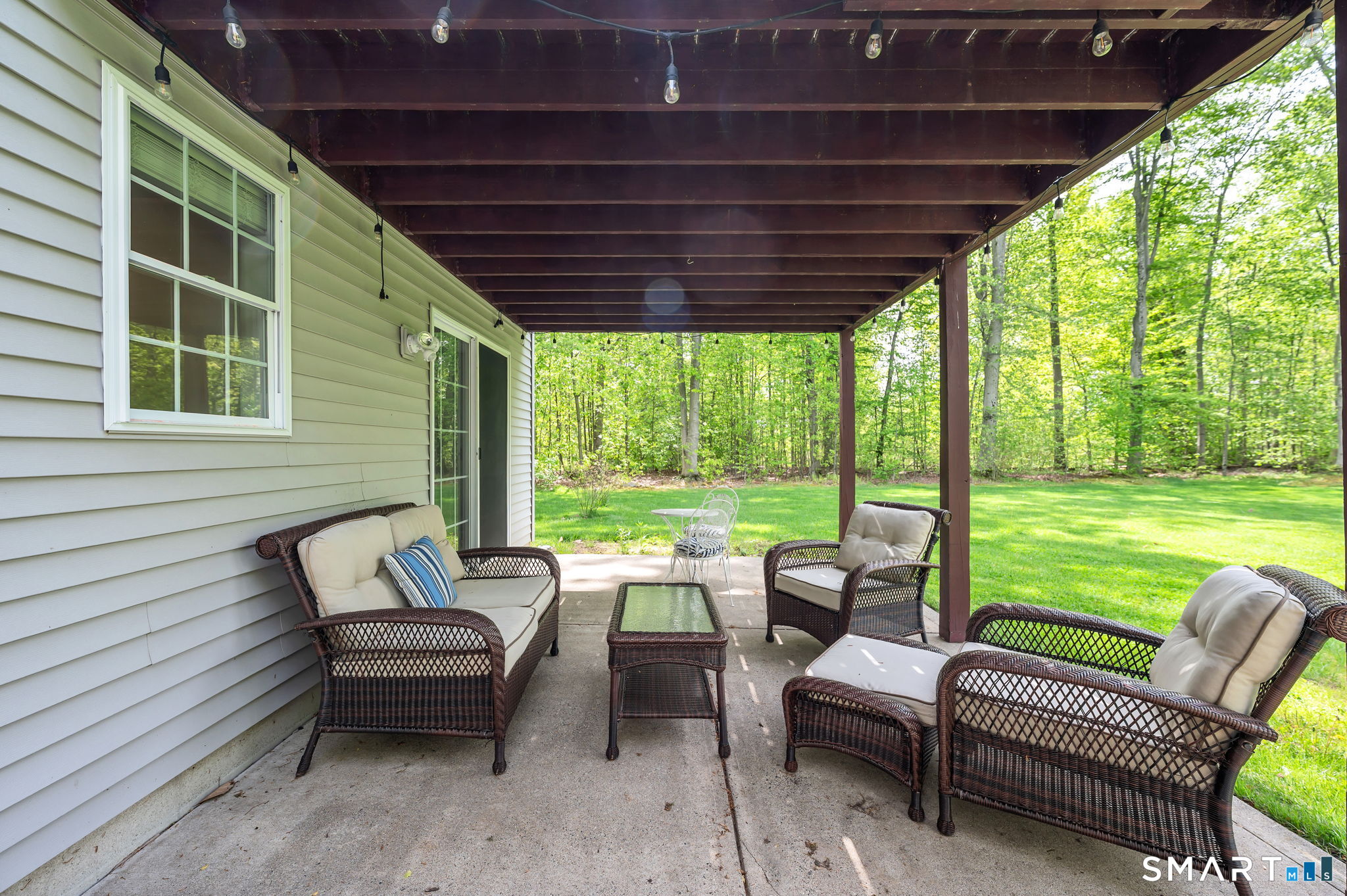 1001 Suffield Street Suffield, CT 06078 - Photo 24 of 30 a balcony with furniture and a garden