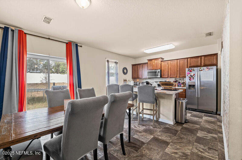 4076 Great Falls Loop Middleburg, FL 32068 - Photo 12 of 30 a view of a dining room with furniture window and outside view