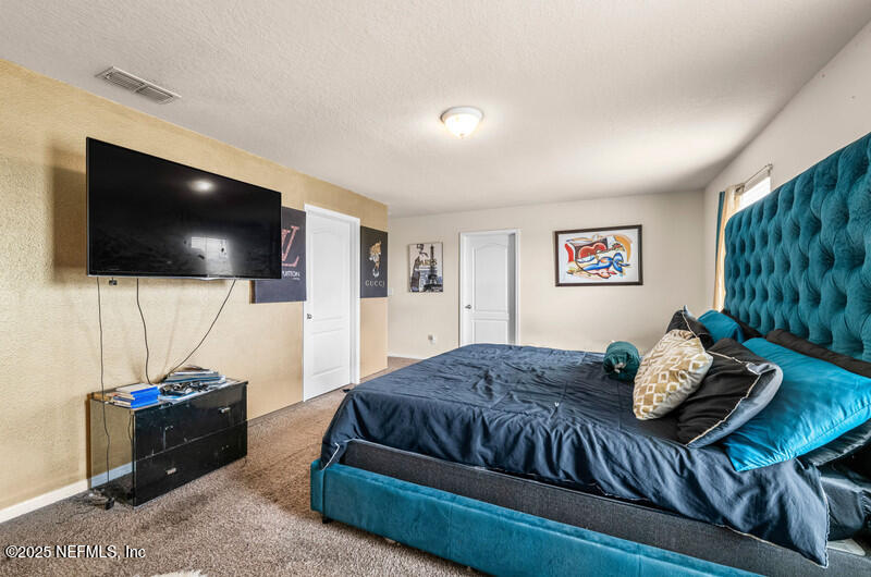 4076 Great Falls Loop Middleburg, FL 32068 - Photo 19 of 30 a living room with furniture and a flat screen tv