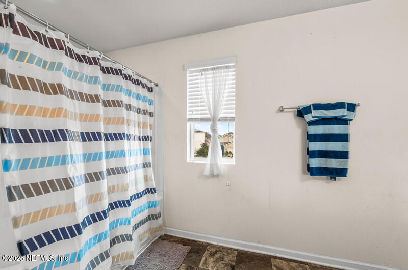 4076 Great Falls Loop Middleburg, FL 32068 - Photo 21 of 30 a view of a bedroom with windows